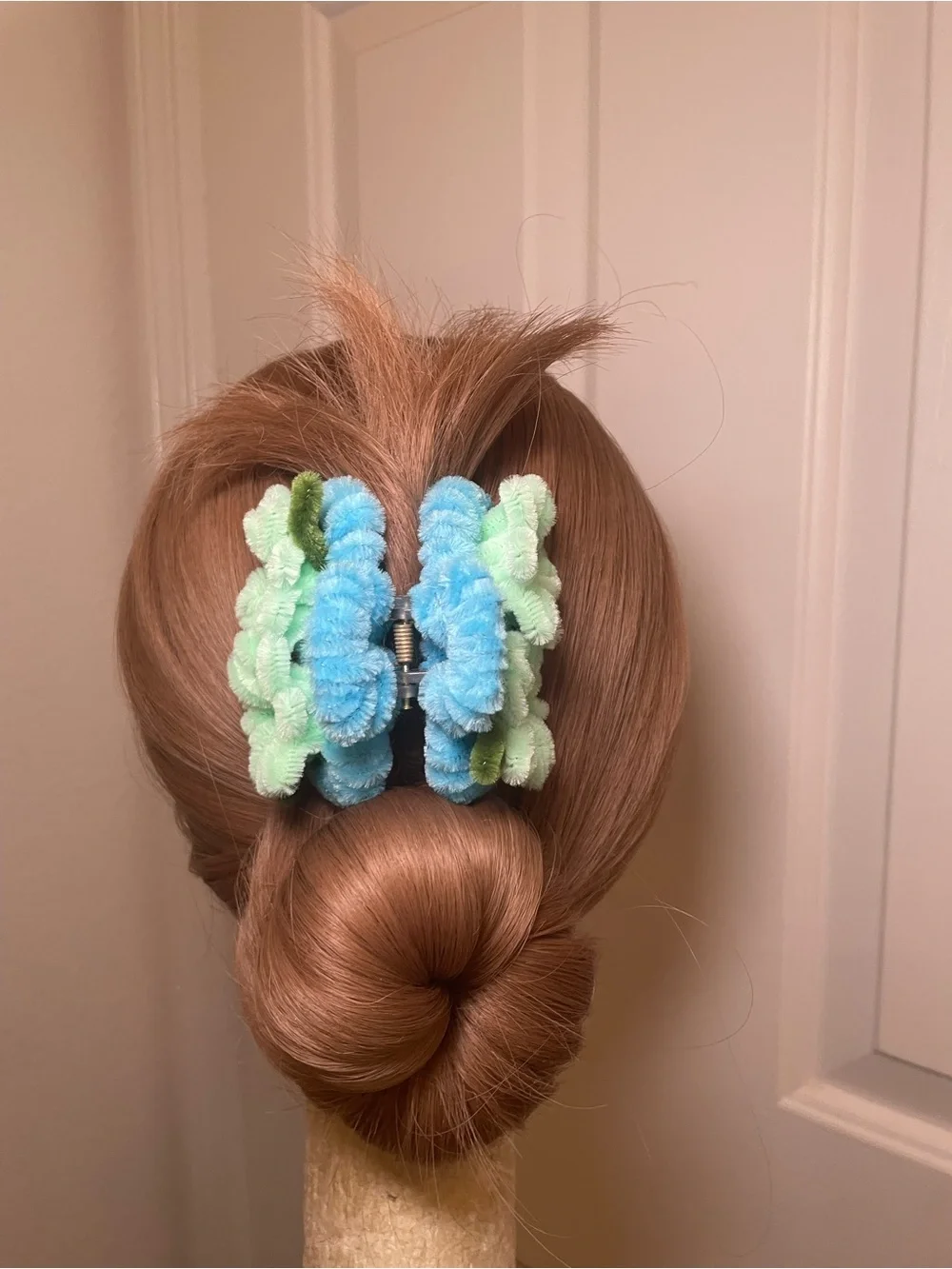 Handmade blue and green pipe cleaner floral hair clip